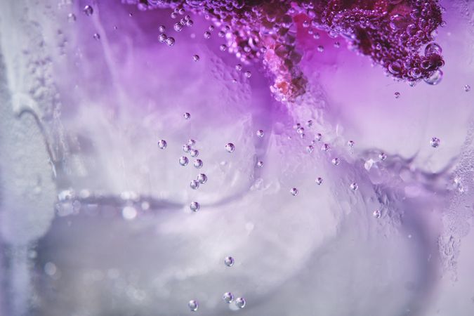 Ice with lilac colored tonic