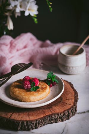 Pancake with fresh raspberry on plate