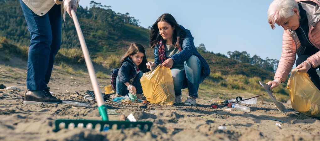 Female volunteers cleaning the beach