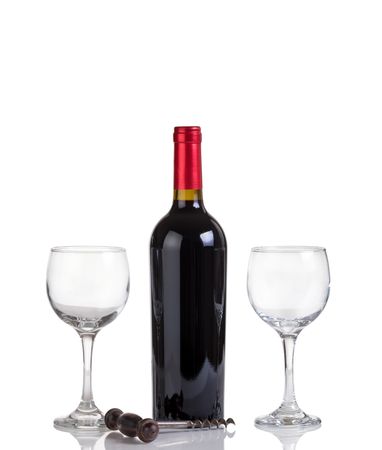 Unopened bottle of red wine and glasses isolated on blank background