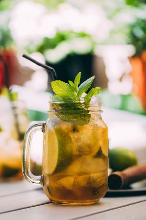 Mojito in mason jar on wooden table