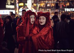Japan - Tokyo, Shibuya Japan - November 29th, 2019: Women dressed in red with arms around each other 56G3z4