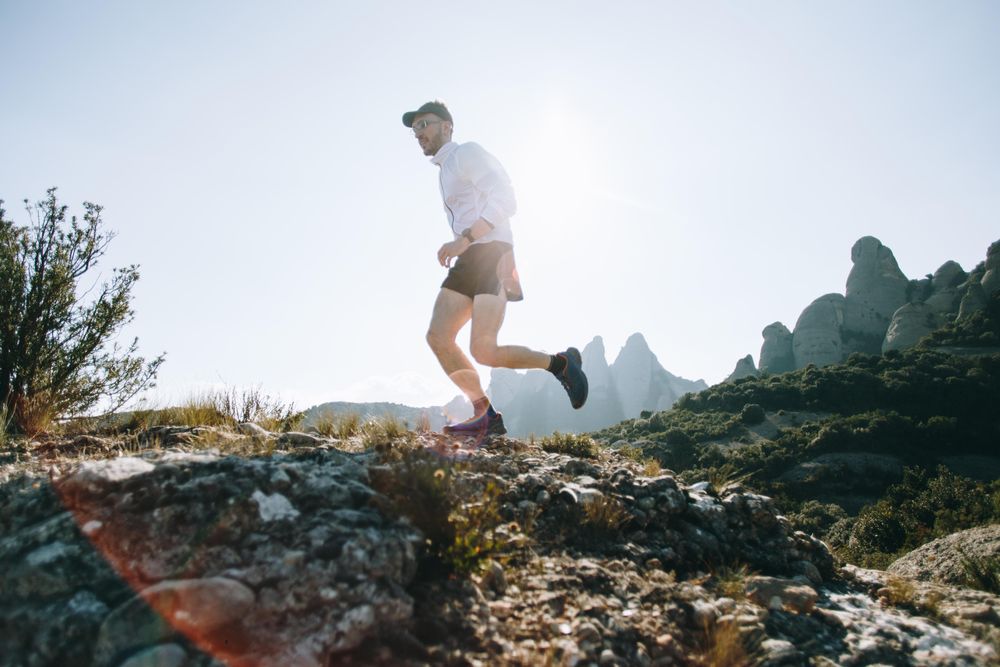 Athlete running on rugged terrain
