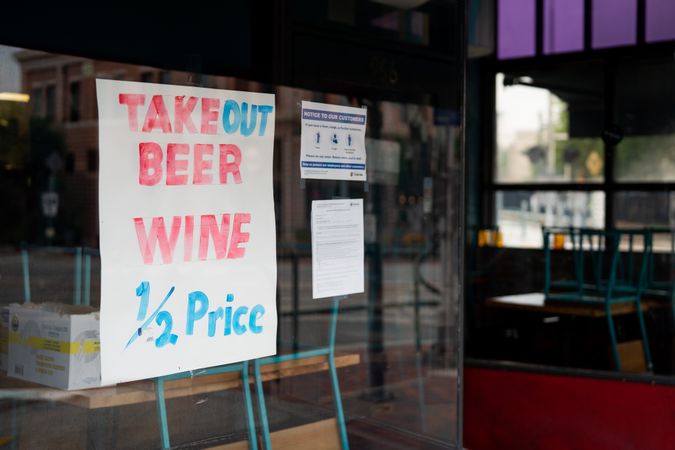 Sign showing discounted wine and beer from restaurant during quarantine