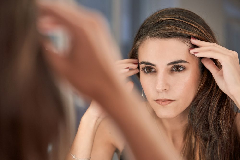 Woman looking at reflection
