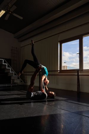 Couple of dancers in a class doing a training in ballet academy