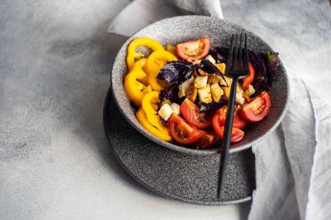 Healthy gourmet salad with tomatoes and yellow peppers
