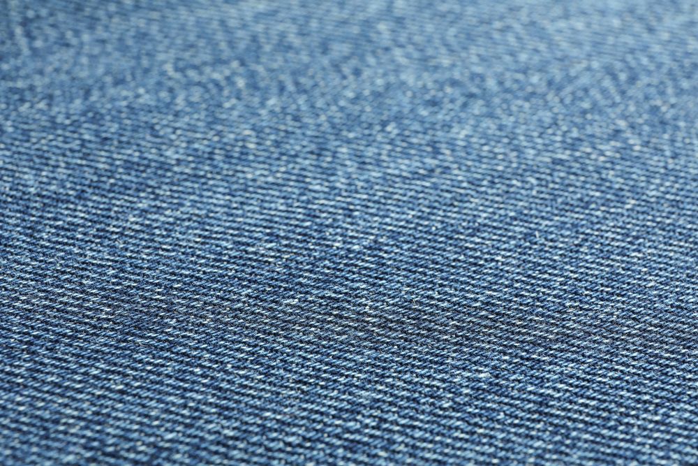 Texture of blue jeans as background, space for text