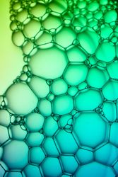 Abstract background bio technology, macro photography foam and water with gradient background. Molecule multicolor backgorund