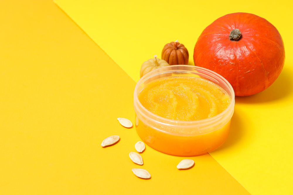 Skin care and face care concept - pumpkin cosmetic