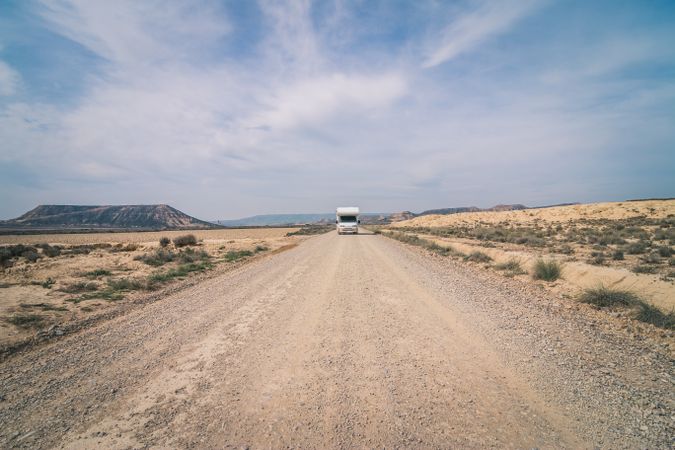 trailer on empty road along desert