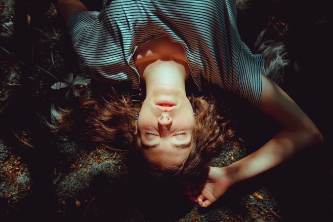 Woman lying on ground