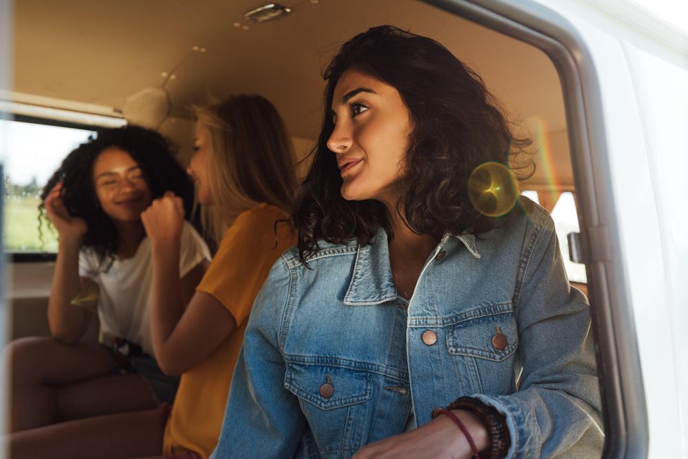 Group of female friends in the back of a car