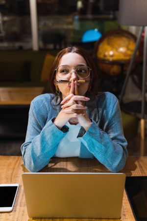 Funny female entrepreneur thinking over problem