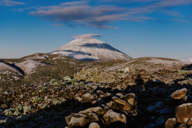 Clouds near snowy mountain