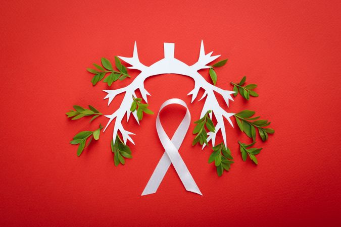 Lung bronchus on red background with ribbon and foliage