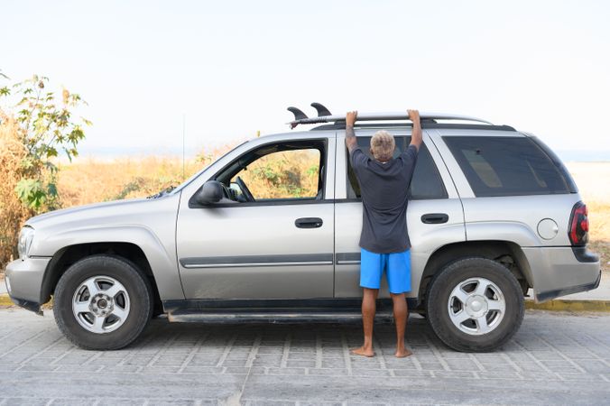 Anonymous woman standing near car