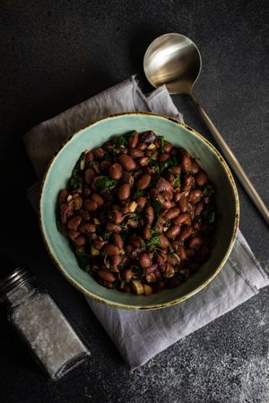 Hearty bowl of Georgian lobio dish atop napkin