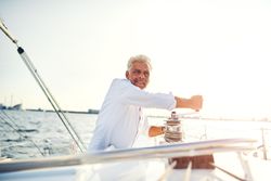 Man on sailing yacht on sunny day