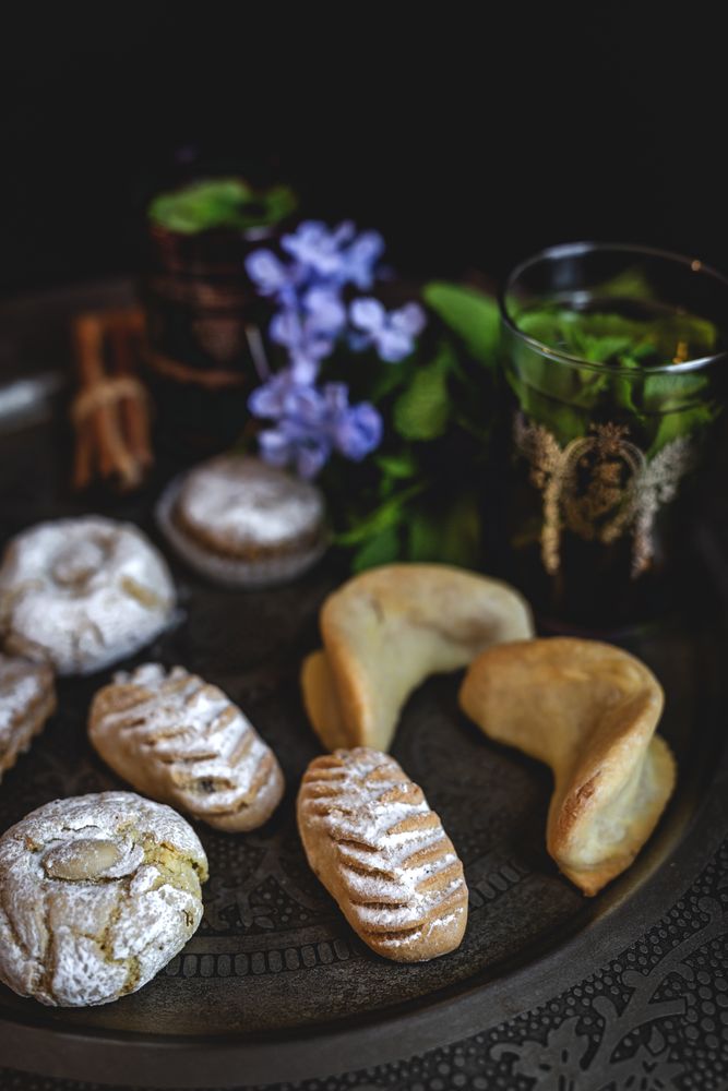 Traditional tea with mint and assorted Arab sweets