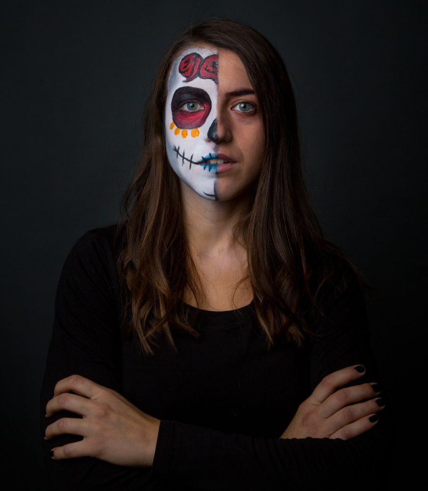 Young woman with creepy face paint