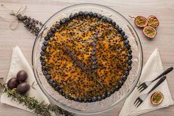 Tasty passion fruit pie decorated with blueberry