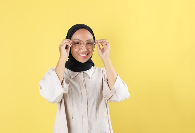 Smiling Asian Young Woman Wearing Glasses