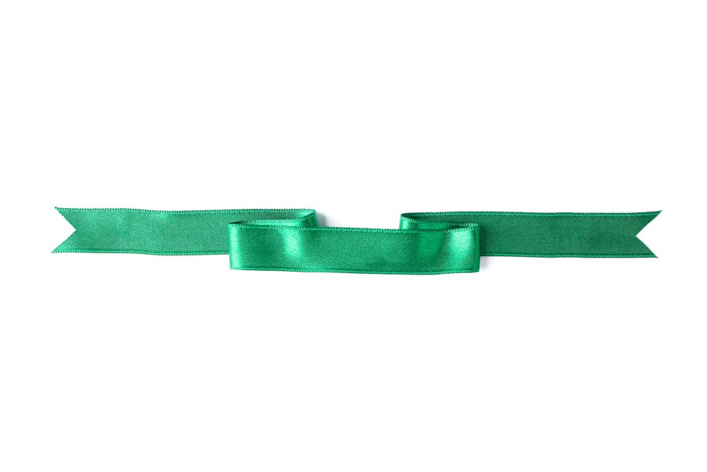 Green ribbon isolated on blank background. Gift concept