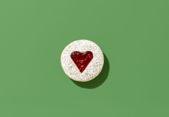 Linzer cookie top view on a green table