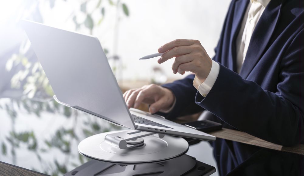 Businessman Working on Laptop at Office Desk