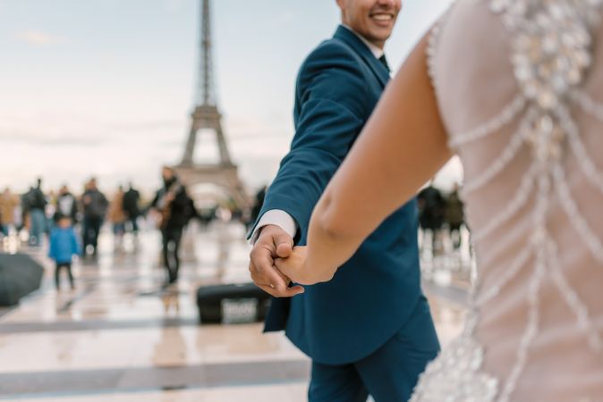 Happy newlyweds in wedding clothing dancing together