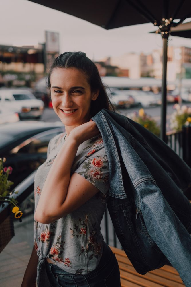 Smiling modern woman standing on street