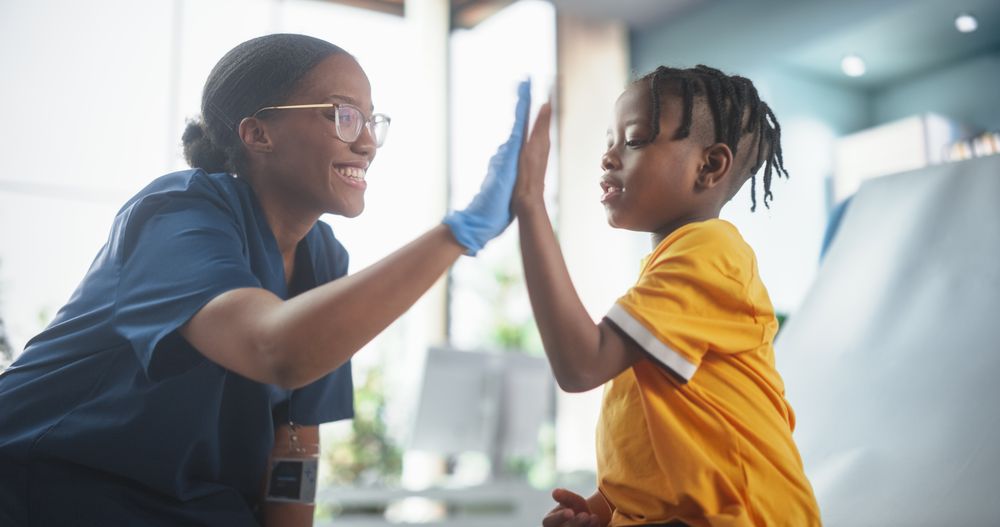 Female Black Nurse Is Finished Performing Injection.