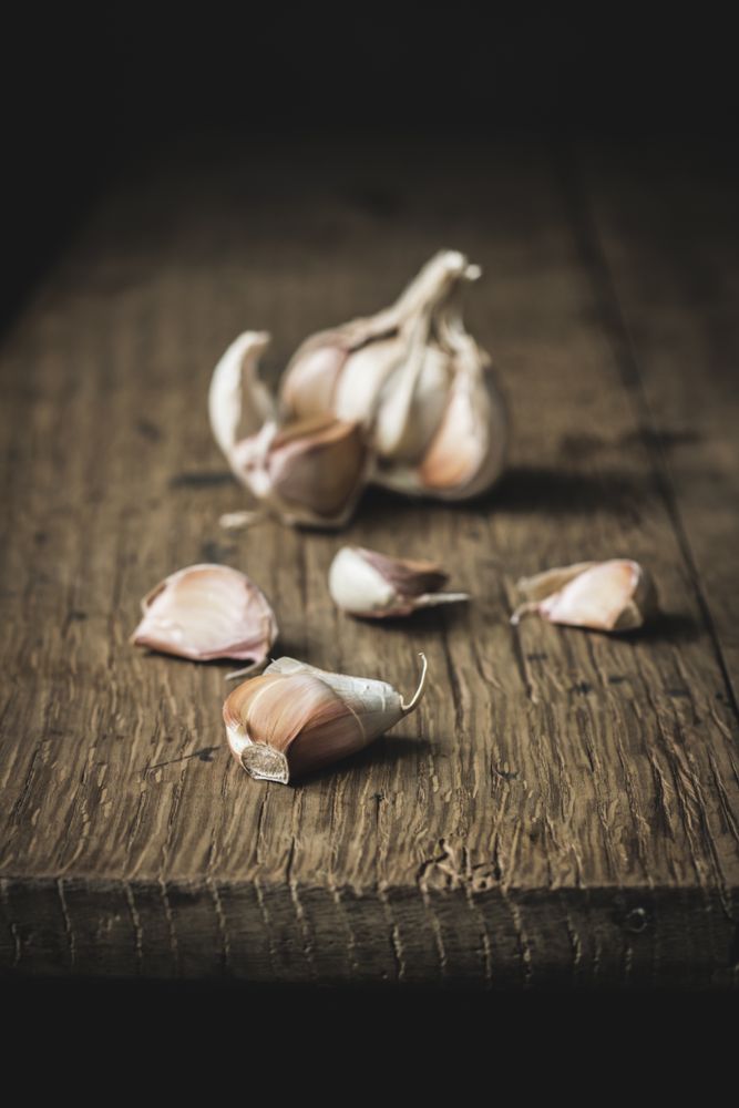 Unpeeled garlic on table