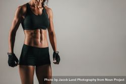 Tight view of woman with strong abdominal muscles 4BavpW