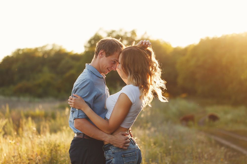 Contented couple embracing at sunset