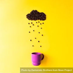 Coffee beans in shape of rainy cloud with purple cup on yellow background 4MggG0