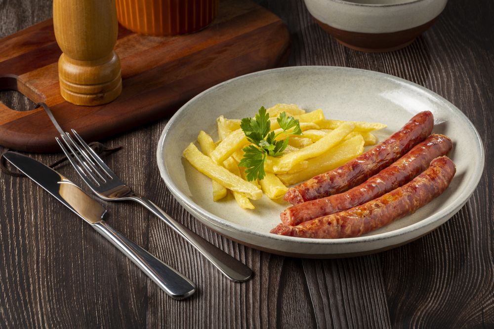 Grilled German sausage with french fries.