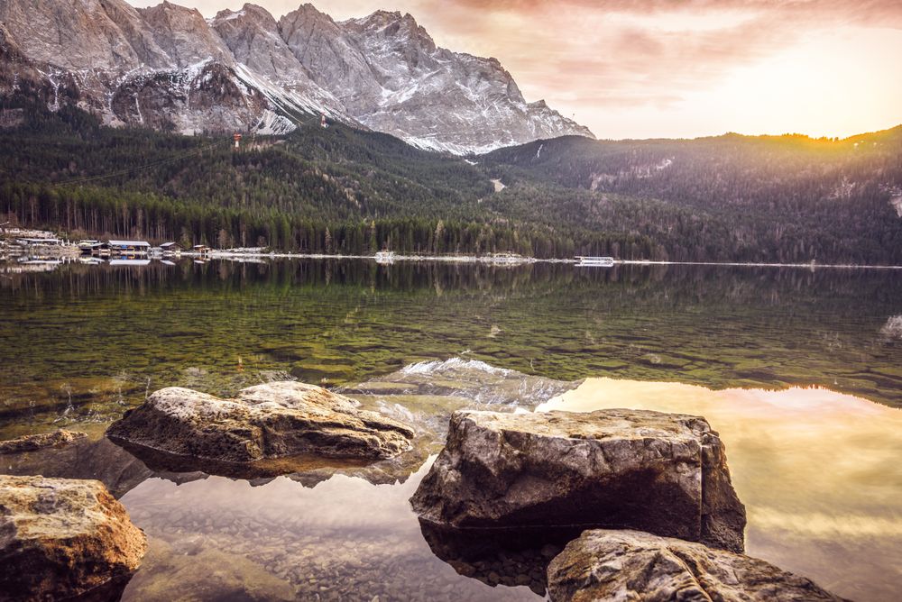 December sunset over mountains and lake