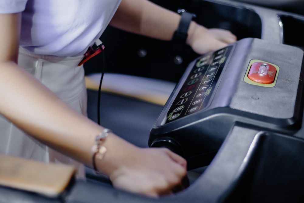 Activating Cardio Machine: Person Interacting with Treadmill Machine