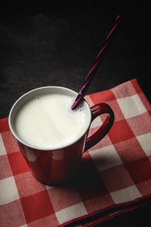 Cup of milk on table