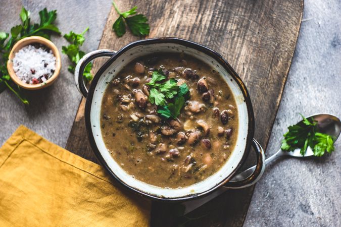 Bowl of hearty bean soup with parsley