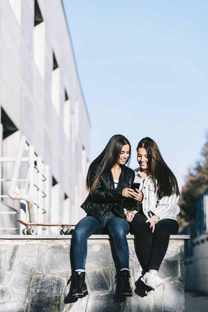 Females using mobile phone