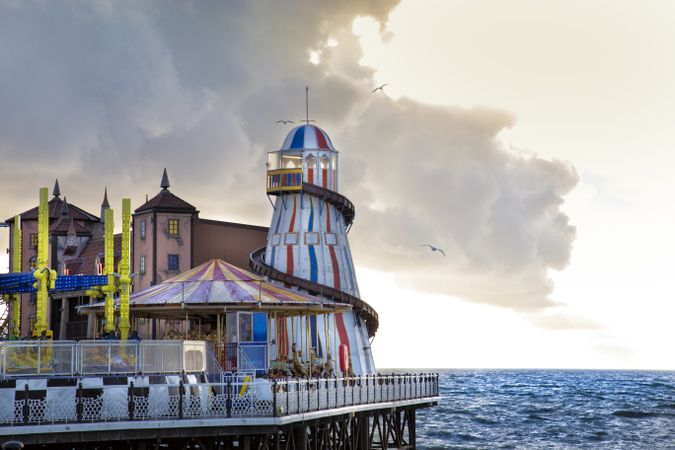 Amusement park on pier in evening