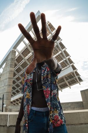 Stylish Black man with stop gesture