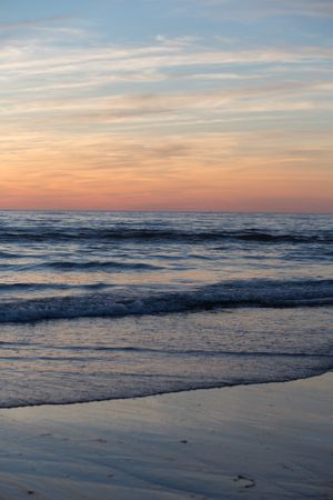 Picturesque view of sandy beach at sunset