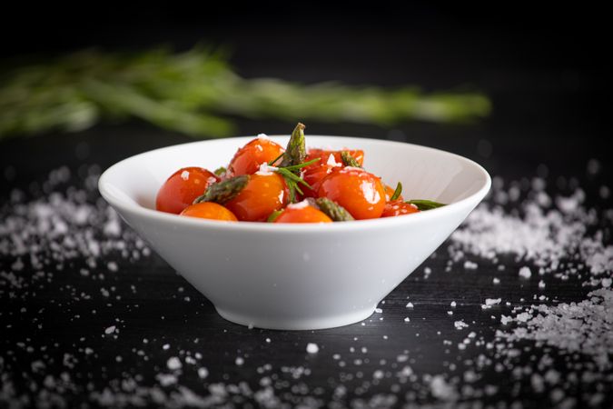 Fresh cherry tomatoes sauteed with green asparagus and rosemary