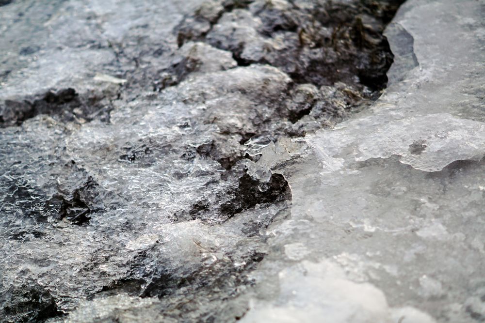 Melted snow crust over rocks