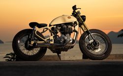 Motorbike near sea during sunset