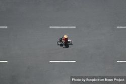 Aerial view of person riding bicycle on empty road bYr9j0